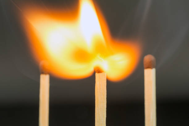 istock the flame of a burning match on a dark  blurred neutral background crisis intervention concept 1019569308