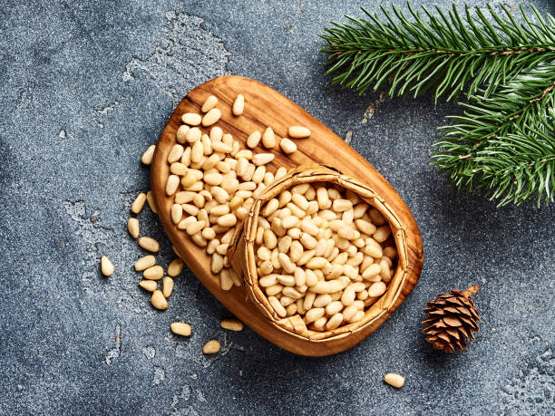 istock Peeled pine nuts with copy space on gray background. Top view. 1019569406
