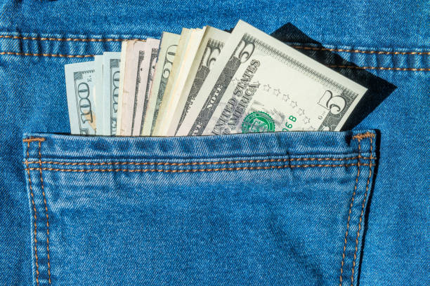 istock Batch of money in blue jeans pocket 1019575834