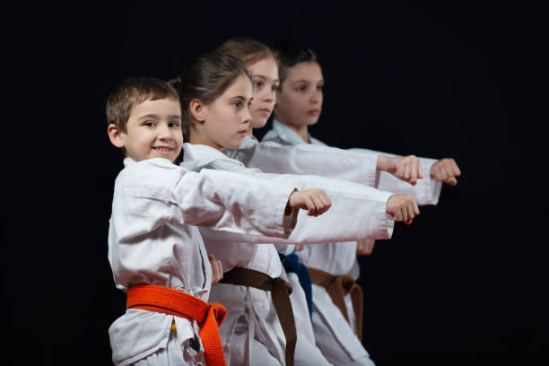 group kids karate martial arts - karate judo belt aikido imagens e fotografias de stock