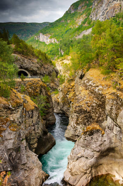 istock Deep Chasm Carved in Bedrock by an Turquoise Colored River in Norway 1019576272