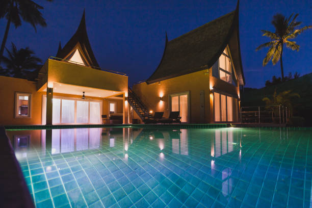 istock beautiful luxurious villa at twilight, luxury private expensive house by night 1019585946