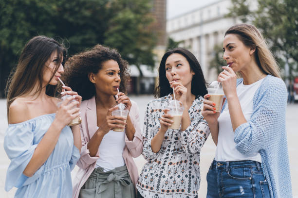 istock Multiracial group of girlfriends drinking ice coffee 1019586178