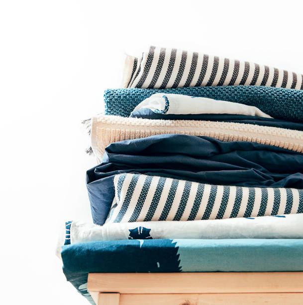 istock Towels, blankets and other home textile in blue and beidge colors 1019589434