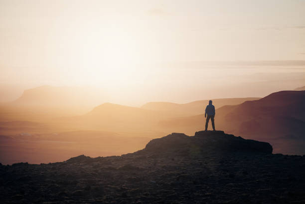 istock Tourist at sunrise in the mountains 1019597412