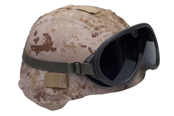 istock us marines kevlar helmet with desert camouflage cover and protective goggles 1019606072