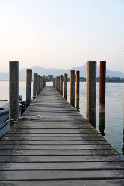 istock lonely landing stage with mountain at background 1019612070
