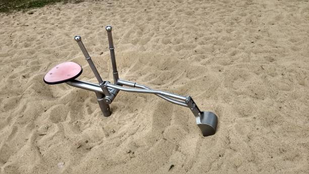 istock Sandbox with toy excavation construction equipment in park playground 1019616864