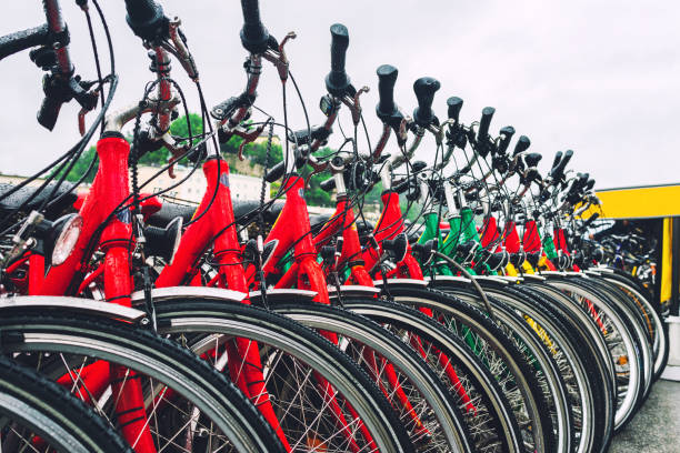Group of red city bicycles parking on the street