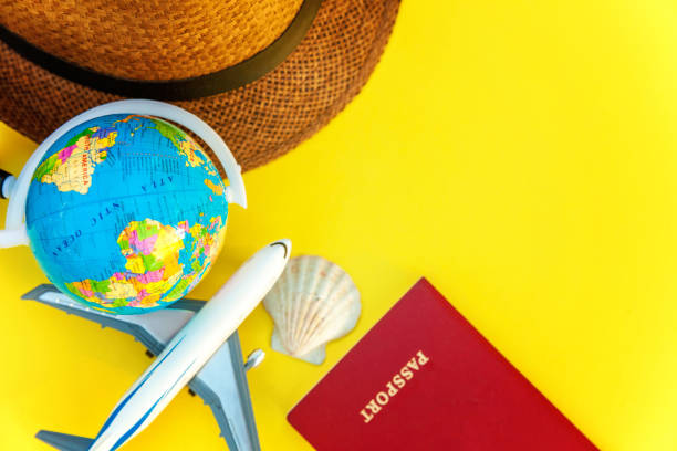 istock Concept of traveling on yellow background 1019628682