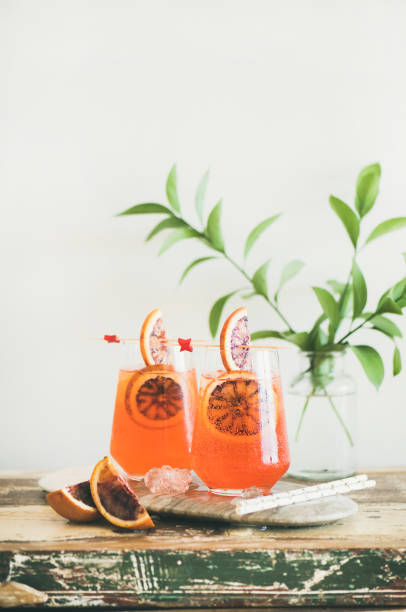 istock Spritz alcohol cocktail with orange and ice in glasses 1019628870