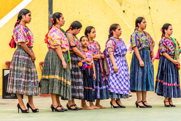 copyspace of a beautiful and smiling indigenous woman from Otavalo, Ecuador with traditional dress looking at camera