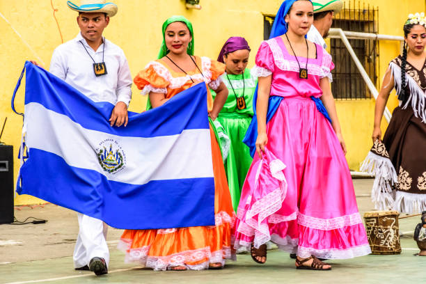 Folk dancers with El Salvador national flag, Guatemala stock photo