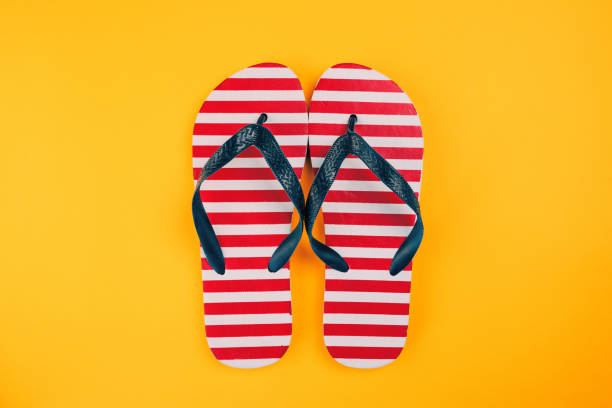 istock Stylish flip flop sandals with USA flag pattern 1019638402