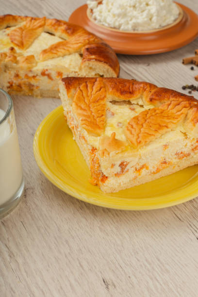 istock Cut homemade curd cake on a wooden background with ingredients 1019645532