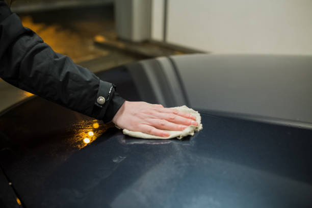 istock Woman washing the car 1019653428