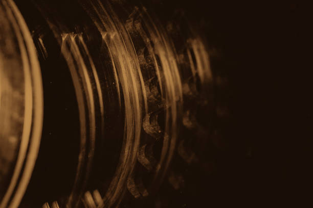 istock Monochrome multi exposition background of gear close up. Artwork from auto part in macro photography. Sepia tones. 1019656452