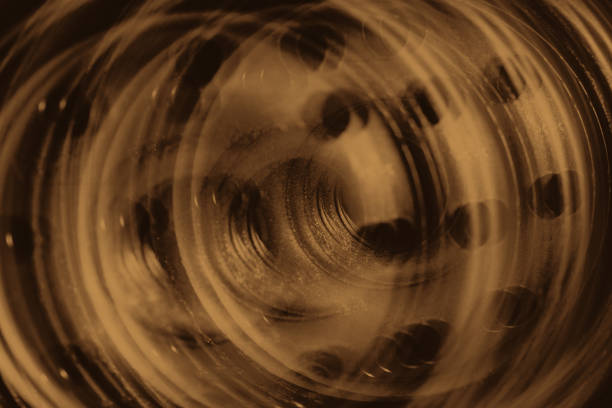 istock Monochrome multi exposition background of oil filter close up. Artwork from auto part in macro photography. Sepia tones. 1019656490