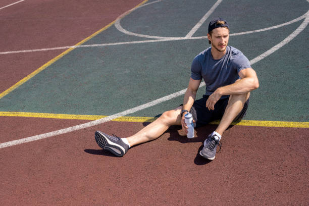 istock Handsome Sportsman Resting 1019658902