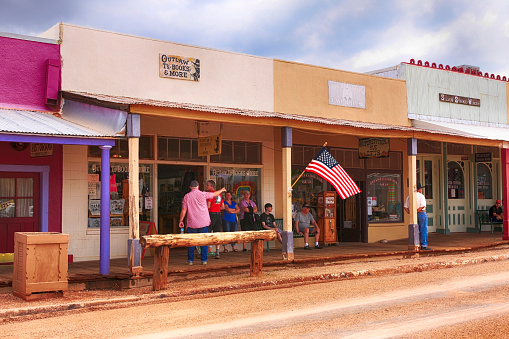 People outside stores on E Allen St selling antques and related artifacts to Tombstone, Arizona