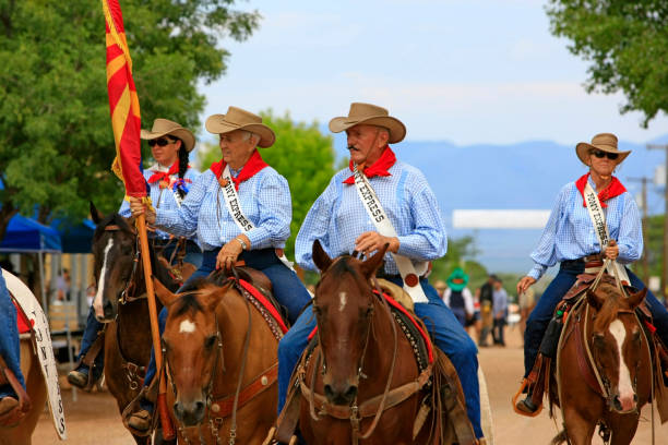 riders of the pony express at the annual doc holiday parade in tombstone, arizona - pony express imagens e fotografias de stock