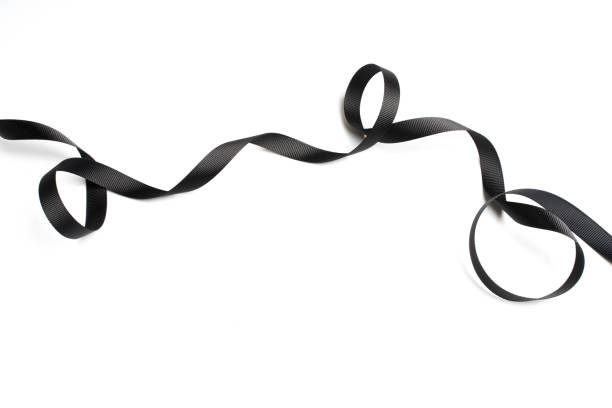 istock beautiful black ribbon twist spiral isolated on white background 1019674004