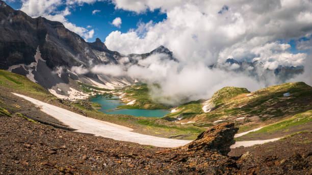 Lake Barroude in sunny mountain valley in Pyrenees stock photo