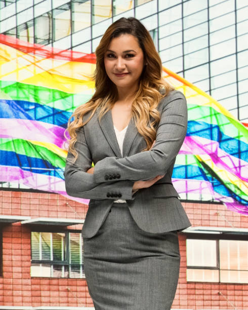 businesswoman supports lgbtq issues - homosexual gay pride business rainbow imagens e fotografias de stock