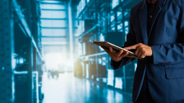 istock Businessman manager using tablet check and control for workers with Modern Trade warehouse logistics. Industry 4.0 concept 1019685326