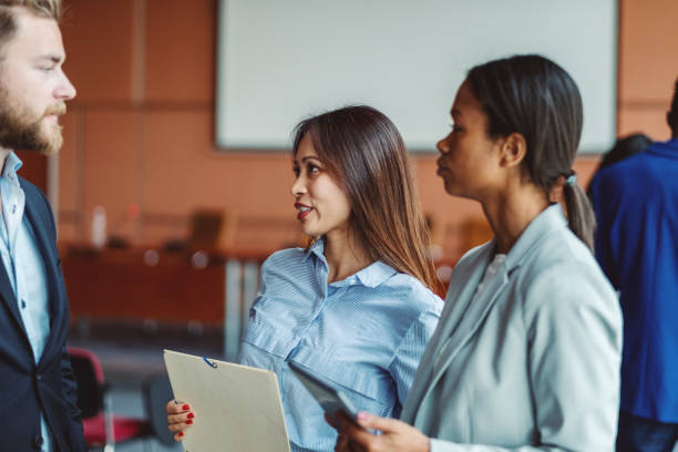 istock Group of business people talking in the office 1019699244