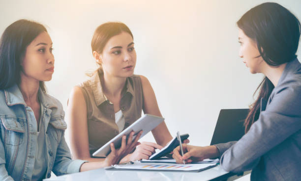 istock Multicultural businesswomen in group meeting. 1019709724