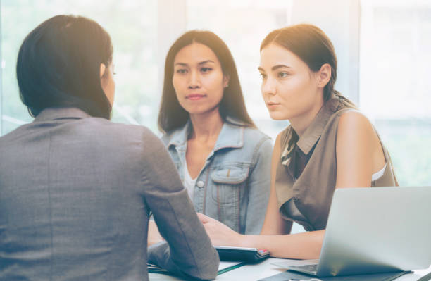 istock Multicultural businesswomen in group meeting. 1019709730