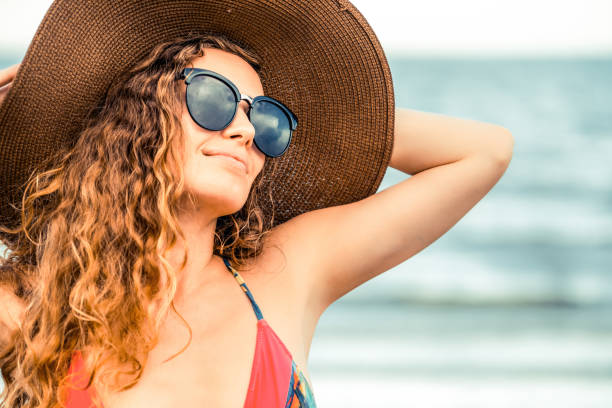 istock Happy young woman at beach in summer vacation. 1019715950