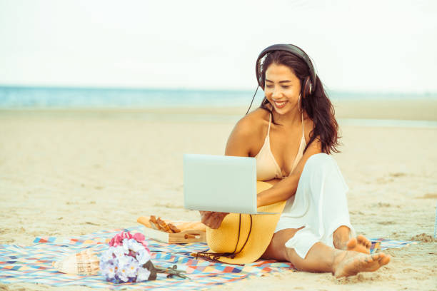 istock Plus size young woman sitting on the beach. 1019716300