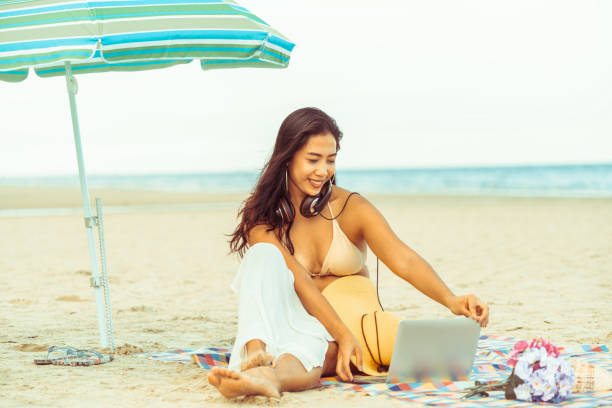 istock Plus size young woman sitting on the beach. 1019716310