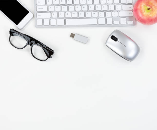 istock Top border of clean office desktop with modern technology and apple fruit 1019720576