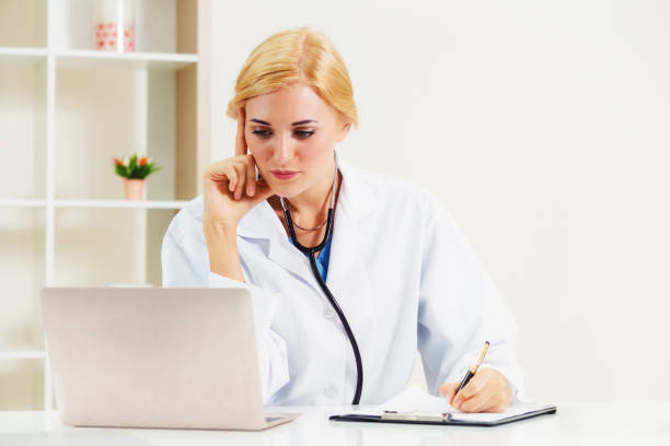 istock Young female doctor working in hospital office. 1019723780