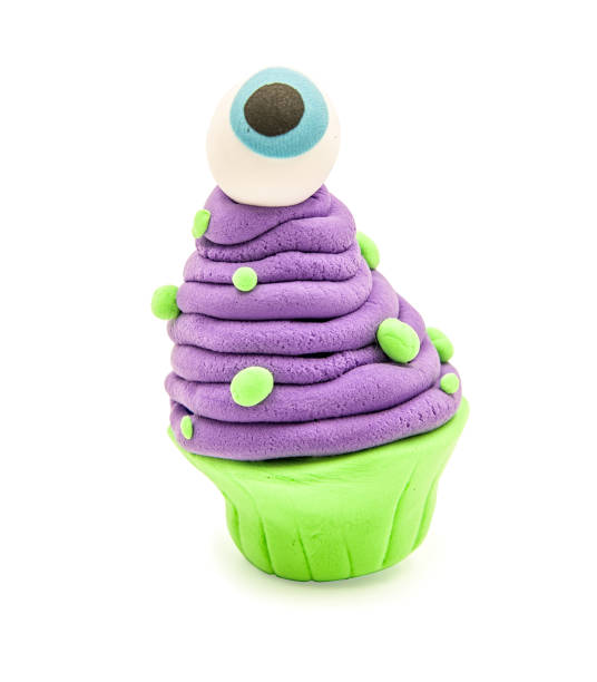 fake clay cupcake halloween craft with eye ball isolated on white with clipping path halloween concept. creative plasticine cupcake craft isolated on white. hand made fake clay craft polymer clay sweets stock pictures, royalty-free photos & images
