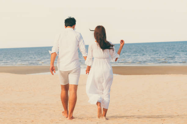 istock Couple going honeymoon on tropical beach in summer 1019729138