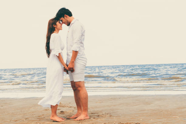 istock Couple going honeymoon on tropical beach in summer 1019729156