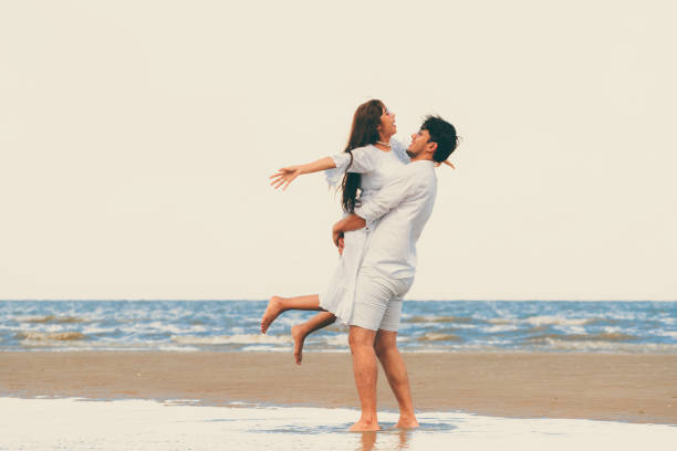 istock Couple going honeymoon on tropical beach in summer 1019729170