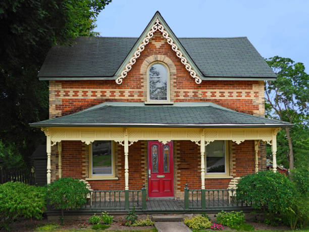 Uxbridge, Ontario, Canada - August 12, 2018:  This style of house with a gable and wide porch was common in Ontario villages in the Victorian period, and many still remain in well preserved condition.