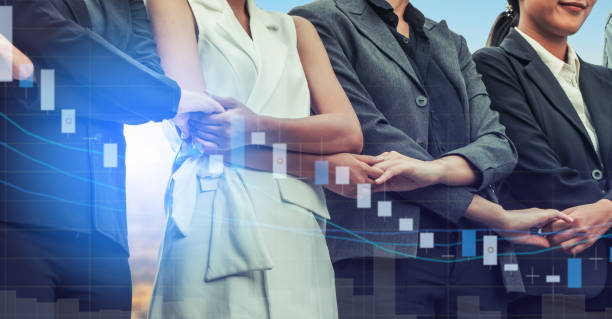 istock Double exposure business people holding hands. 1019729558