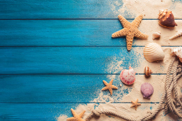 istock Summertime concept on blue wooden background 1019741974