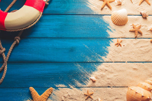 istock Summertime concept on blue wooden background 1019742002