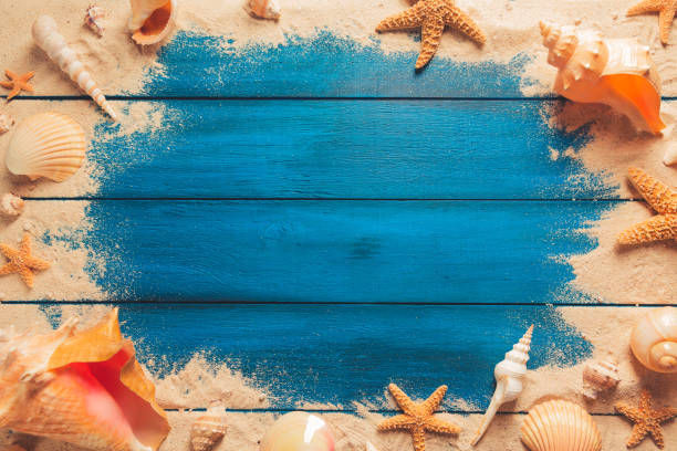 istock Summertime concept on blue wooden background 1019751628