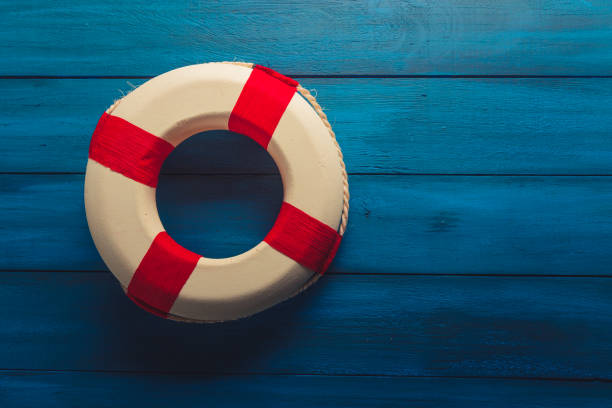 istock Life saver on a blue wooden background 1019754542