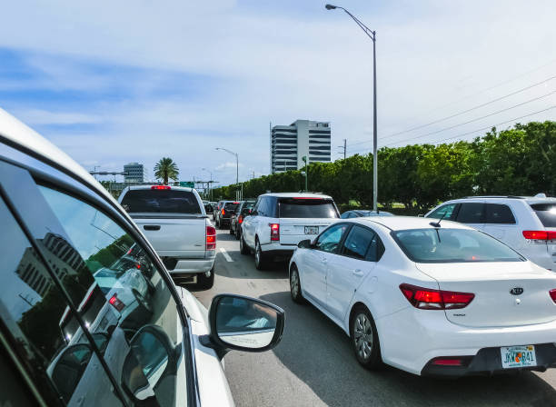 Miami, Florida, USA - May 10, 2018: The many cars at traffic jam on a highway in Miami, FL, USA Miami, Florida, USA - May 10, 2018: The many cars at traffic jam on a highway in Miami, FL, USA on May 10, 2018. kendall stock pictures, royalty-free photos & images