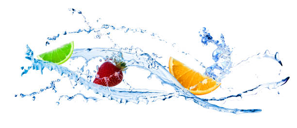fresh red strawberry, lime and orange slice spashing into blue water on white background - wet strawberry macro fruit imagens e fotografias de stock