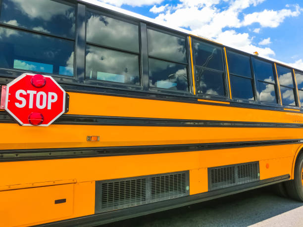 istock School buss on freeway road at Orlando, Florida, USA 1019778288
